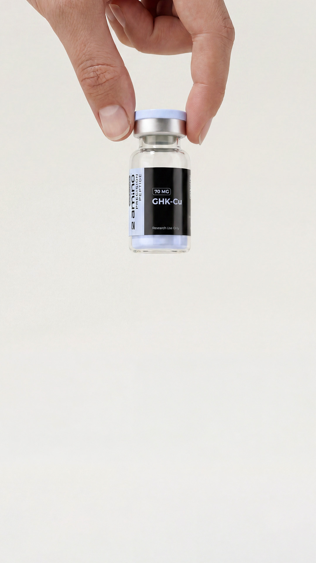 Hand holding a 2amino GHK-Cu research vial